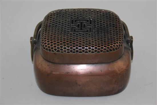 A Chinese copper bronze oblong hand warmer, 18th / 19th century, 15cm